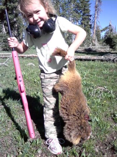 I'm  not sure what animal that is, but she shot it with her Crickett Rifle