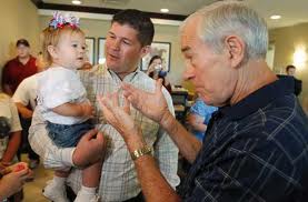 The guy holding the baby - huge crook